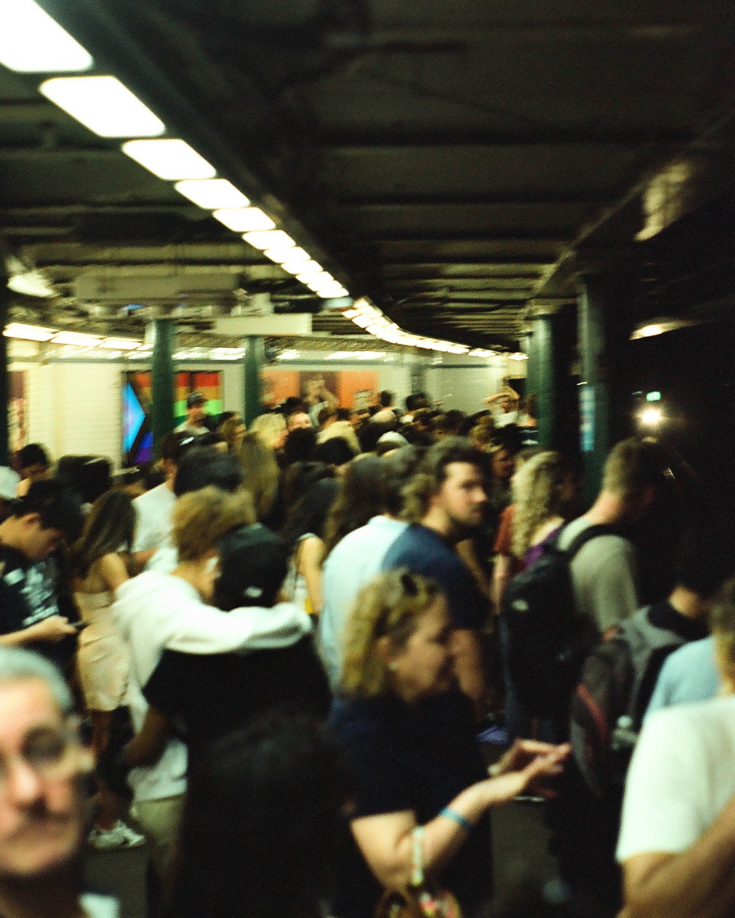 Crowded subway platform shot on expired film